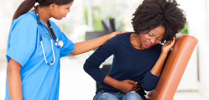 woman girl stomach cramps with nurse