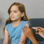 girl gets vaccine