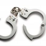a pair of unlocked hand cuffs