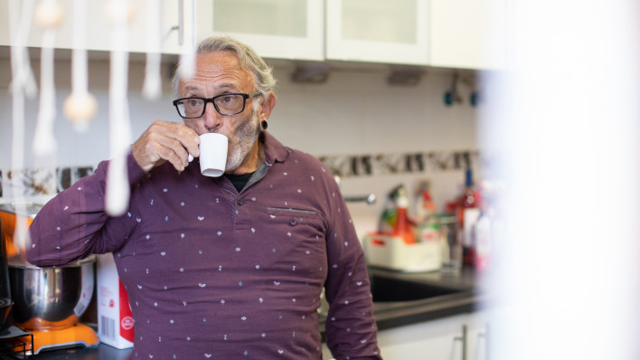 Portugal A healthy senior man living with HIV drinking coffee