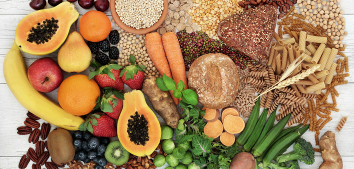 food with high fiber content for a healthy diet with fruit, vegetables, whole wheat bread, pasta, nuts, legumes, grains and cereals