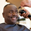 African American Barber Shop Smile man getting hair cut