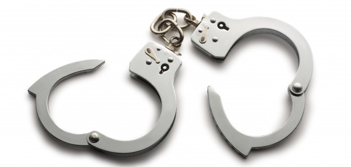 a pair of unlocked hand cuffs