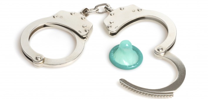 handcuffs and a blue condom