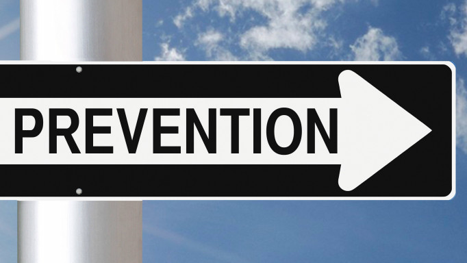 Ounce of Prevention sign against a blue sky